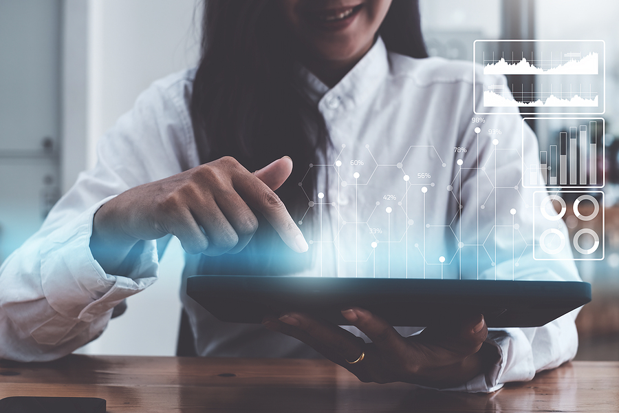 woman using tablet for improved financial reporting
