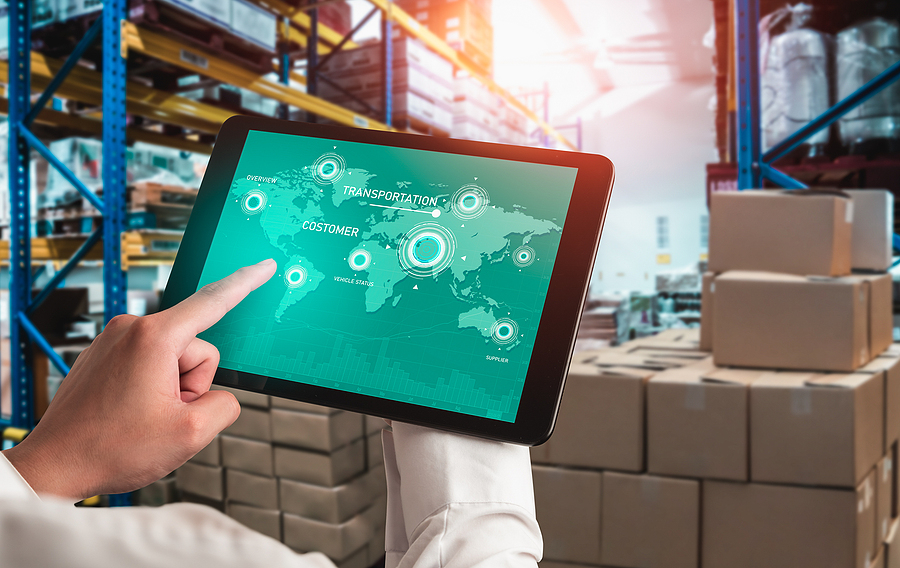 Warehouse management innovative software in computer for real time monitoring of goods package delivery . Computer screen showing smart inventory dashboard for storage and supply chain distribution .