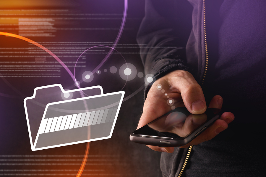 Hand with mobile smart phone transfering files to cloud folder. New technology data backup or file sharing concept.