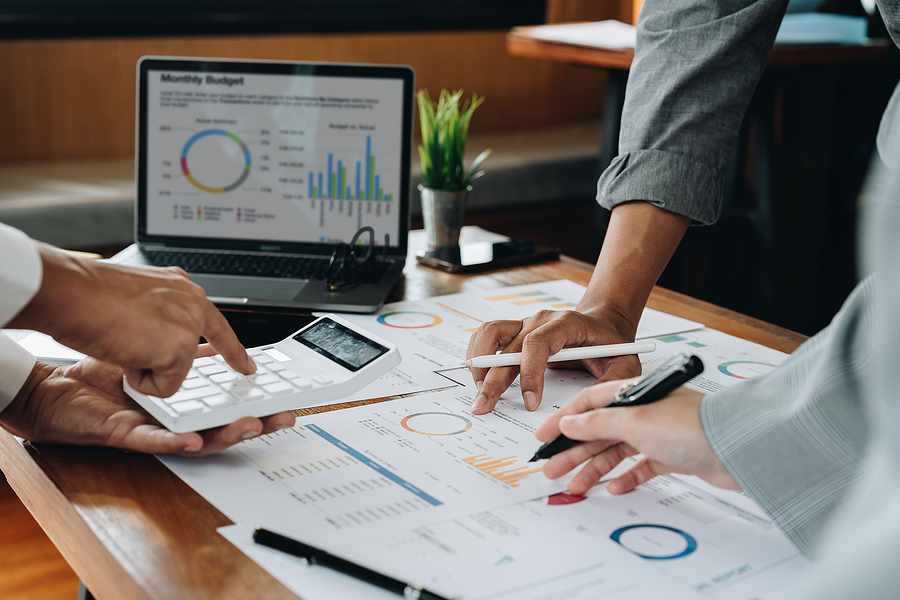 business adviser meeting to analyze and discuss the situation on the financial report. Financial advisor and accounting concept.