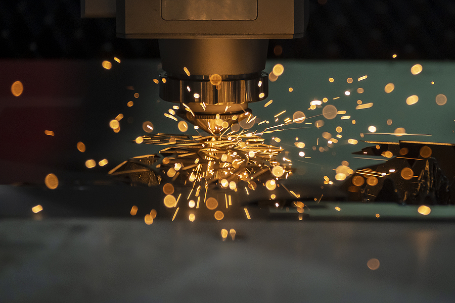 fiber laser cutting machine cutting machine cut the metal plate. The hi-technology sheet metal manufacturing process representing Acumatica Manufacturing