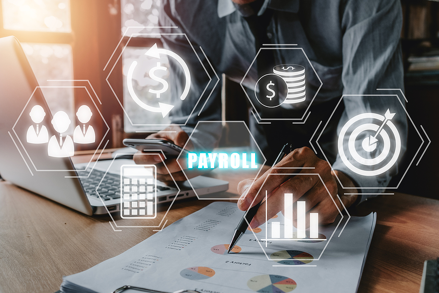 Payroll business finance concept, Businessman analyzing financial data with Payroll icon on VR screen, Financial, accounting. Sage 100 Payroll