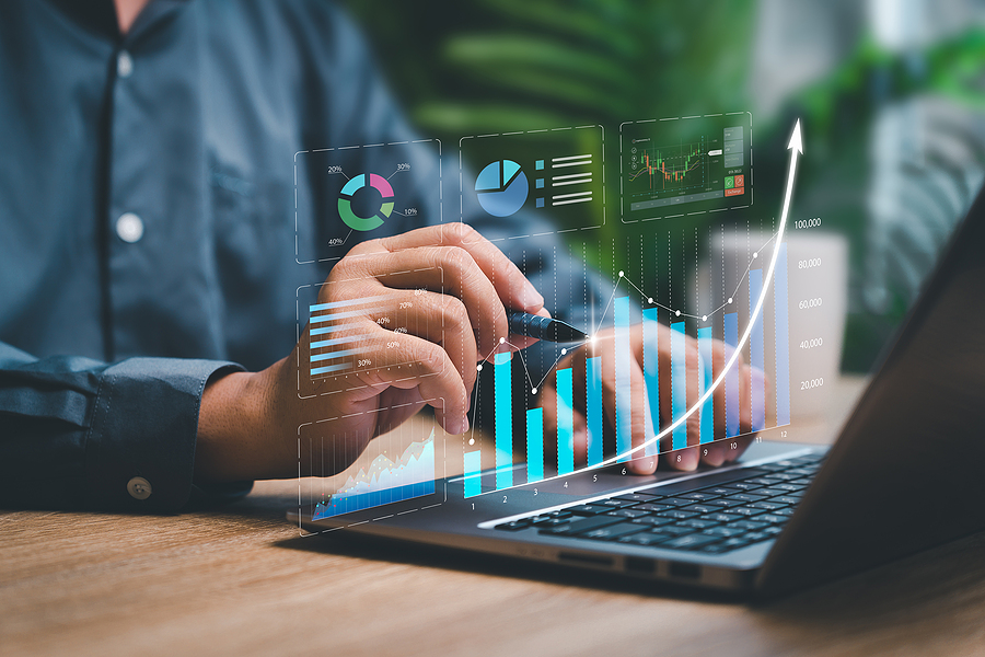 Digital business marketing data management on virtual screen, with arrow trending upwards to indicate erp cloud software enhancing growth