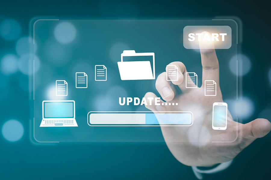 Person using virtual touch screen which says update to represent Sage 100 Updates