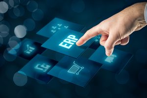 Enterprise resource planning ERP concept. Businessperson clicking on ERP software button. ERP strategy